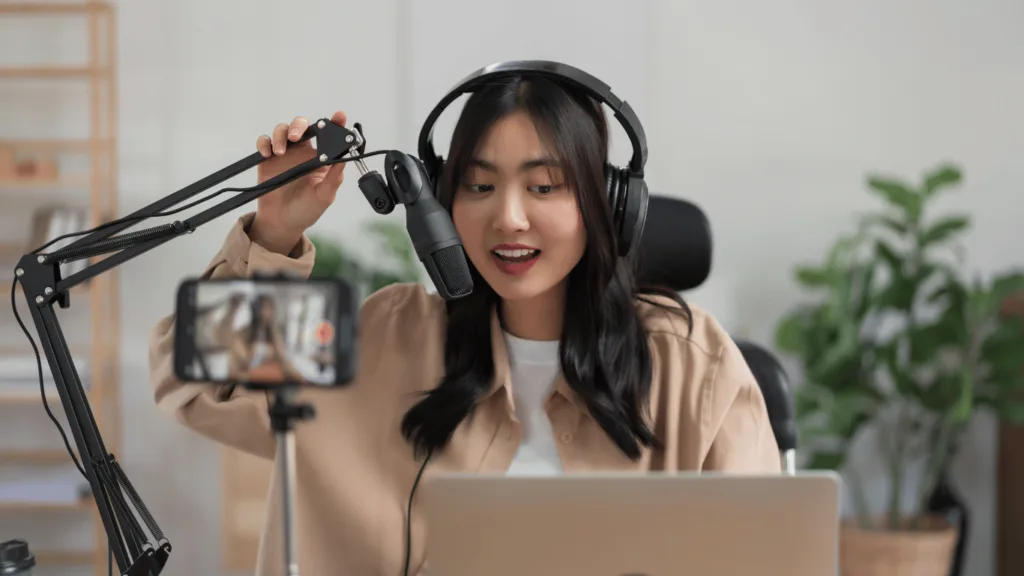 Coach in a home podcast studio to record audio for their first podcast to be submitted on podcast platforms