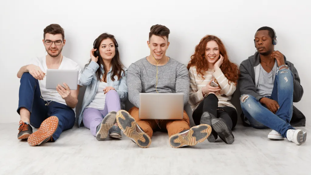 Image of many coaching clients outdoors listening to multiple episodes of a podcast hosted by a coach